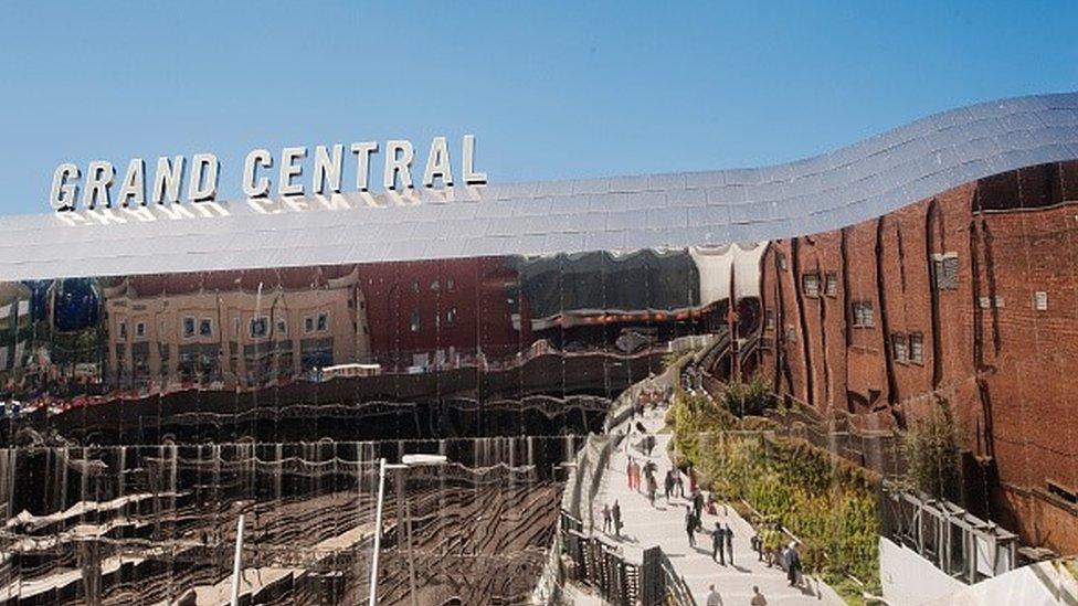 The shiny metal curved roof of Grand Central shopping centre above Birmingham New Street station