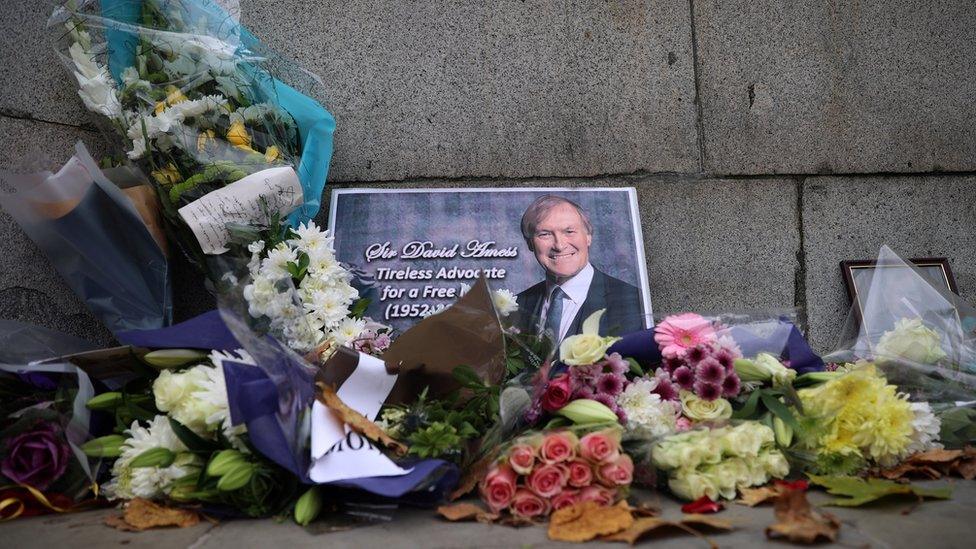 Floral tributes to Sir David Amess left outside Parliament