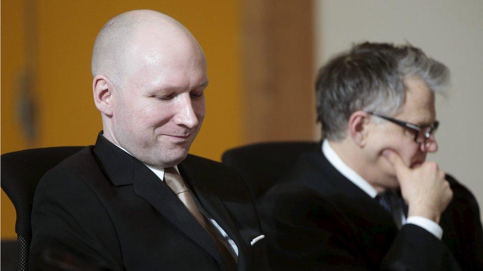 Mass killer Anders Behring Breivik (L) seats by his lawyer Oystein Storrvik inside the court room in Skien prison, March 15, 2016.