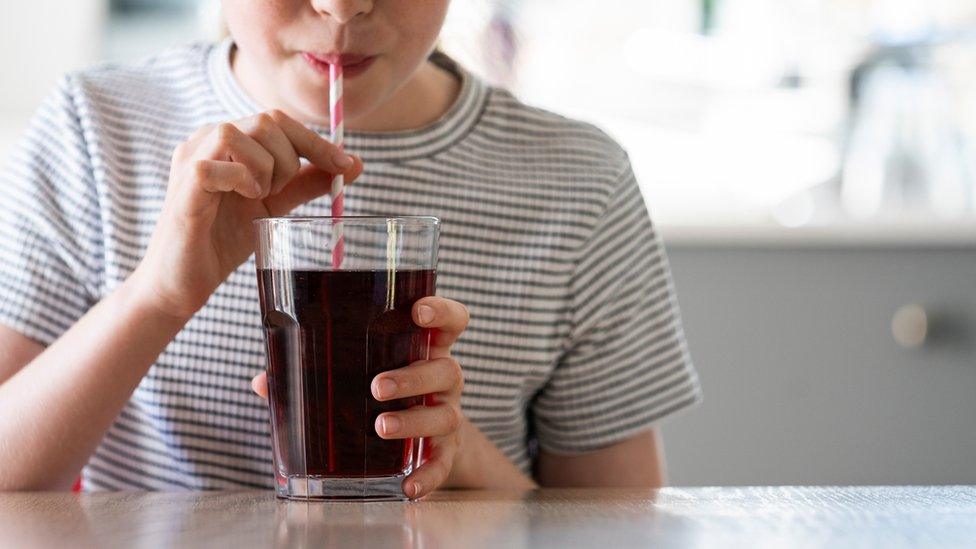 girl-drinking-soft-drink.