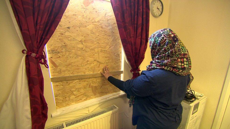 Window boarded up after racist attack on family home