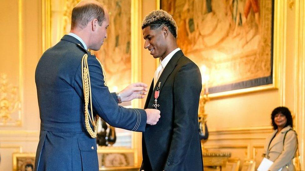 Marcus Rashford being made an MBE by Prince William