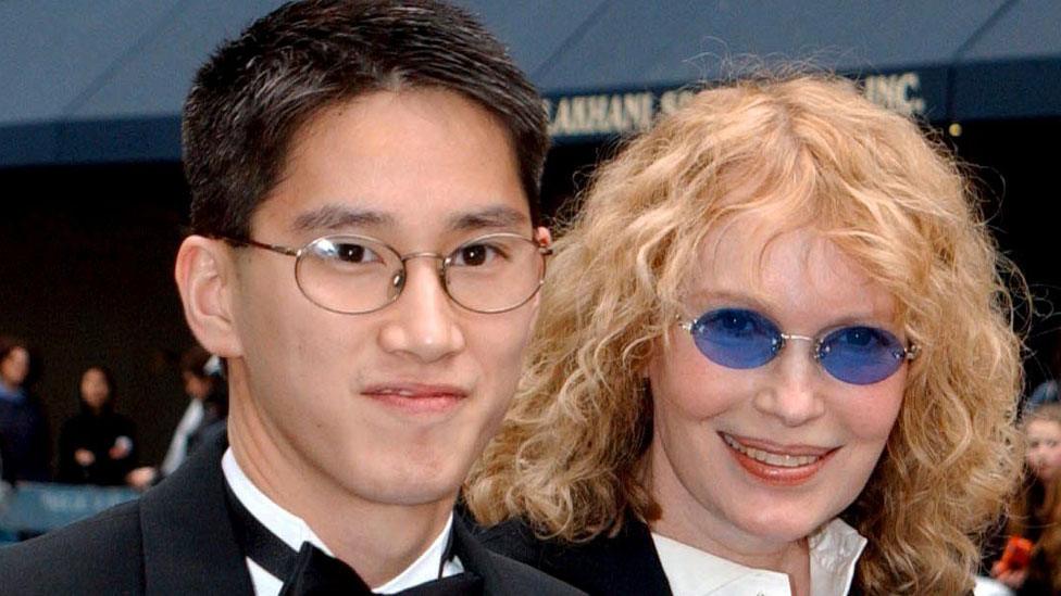 Moses Farrow with Mia Farrow in 2002