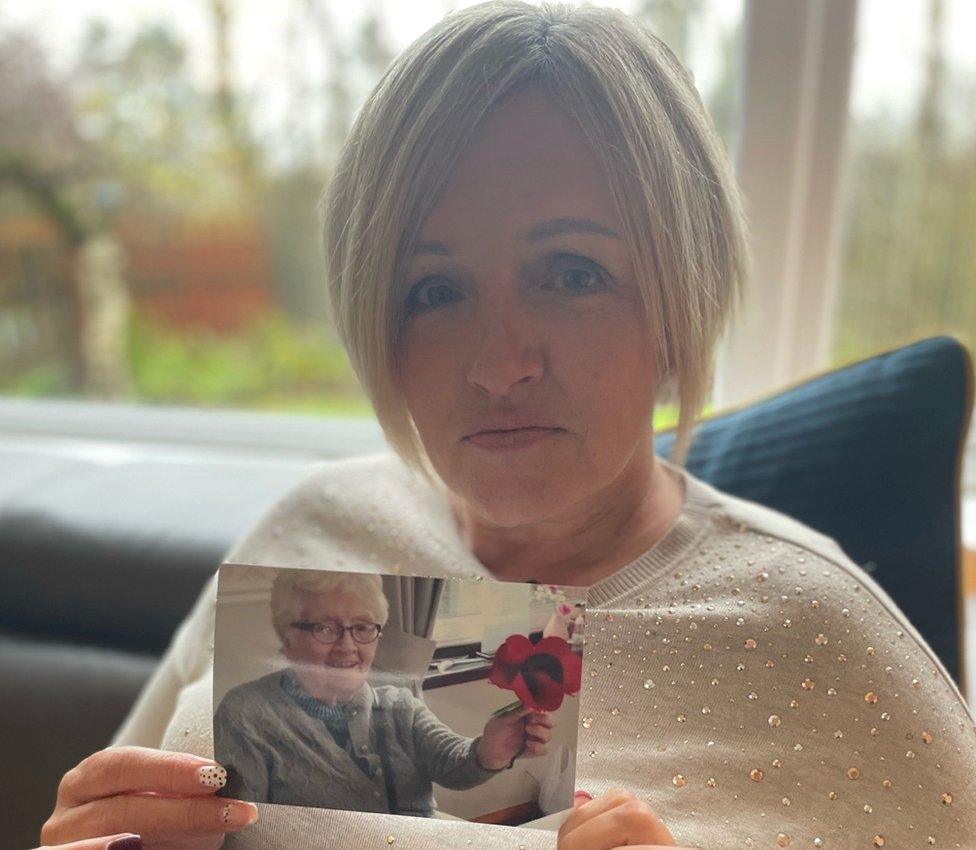 Shelia Beattie with photo of her mum Kathy