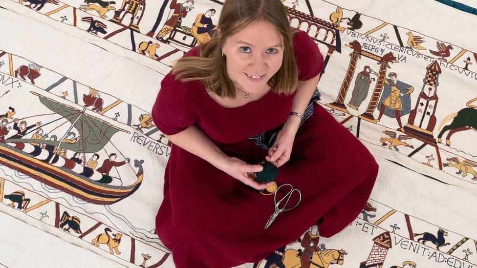 Mia Hansson with her unfinished recreation of the Bayeux Tapestry