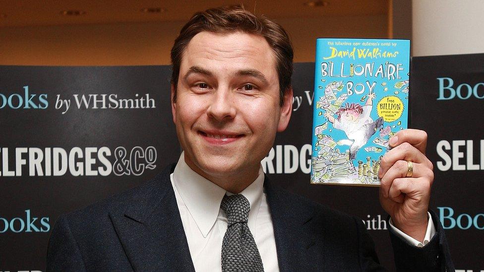 David-Walliams-holding-copy-of-Billionaire-Boy