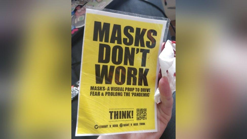 The anti-mask poster which had a razor blade behind it in Cardiff