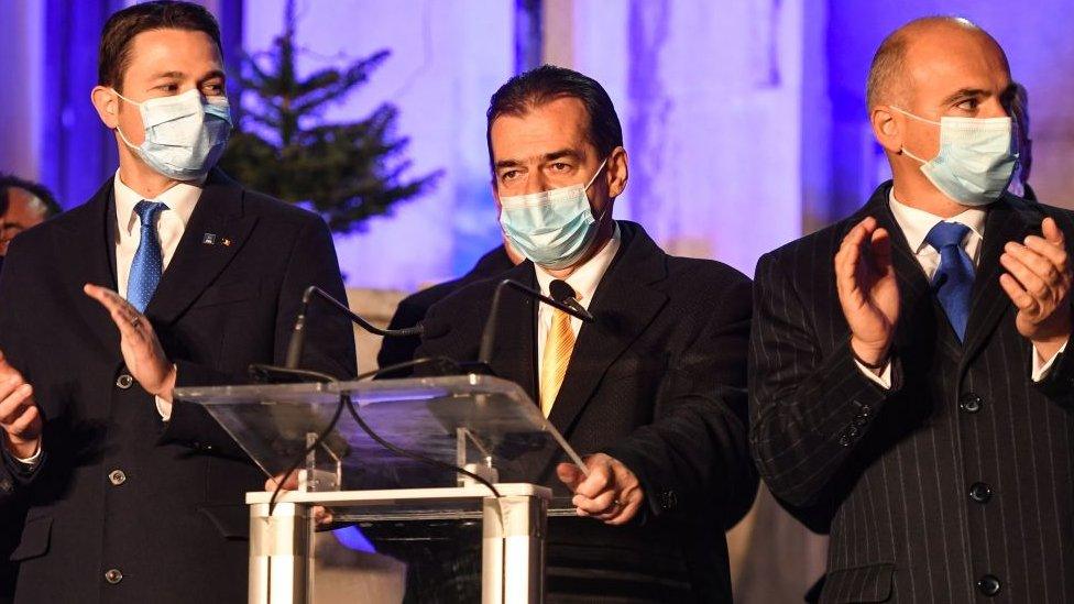 Ludovic Orban (C) addresses a presser at PNL headquarters in Bucharest December 6, 2020