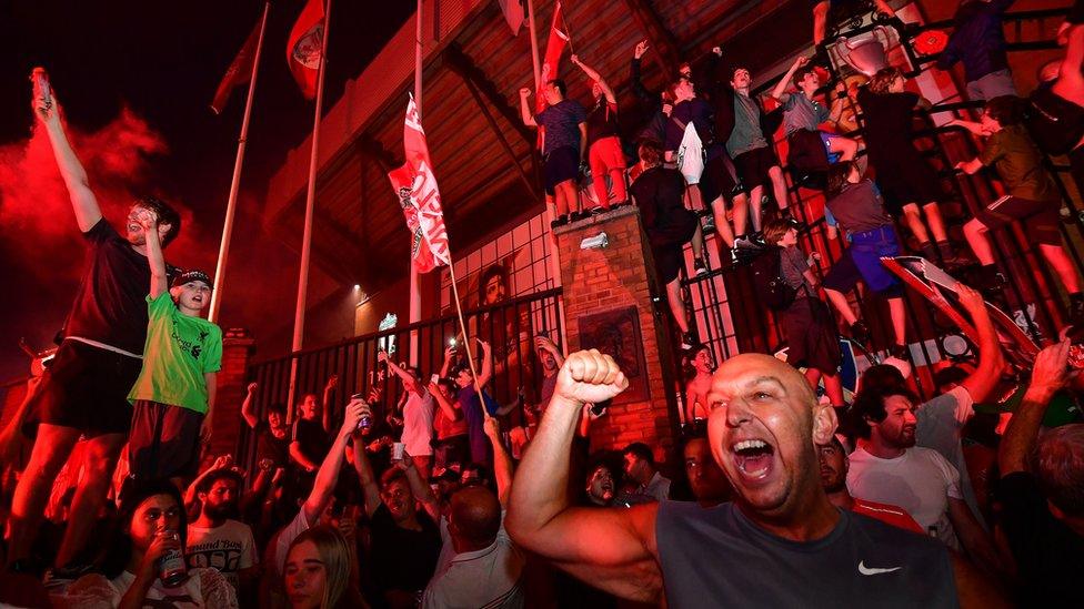 Fans celebrate Liverpool becoming Premier League Champions outside Anfield