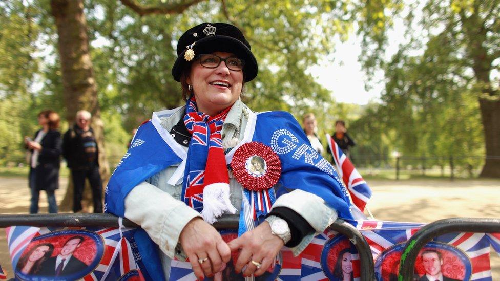 Royal family fan Jane Giannoulas, from San Diego, USA, rests on the Mall to wait for a sight of the Prince William and Catherine Middleton returning to Buckingham Palace following tomorrow's marriage ceremony in Westminster Abbey on April 28, 2011 in London, England.