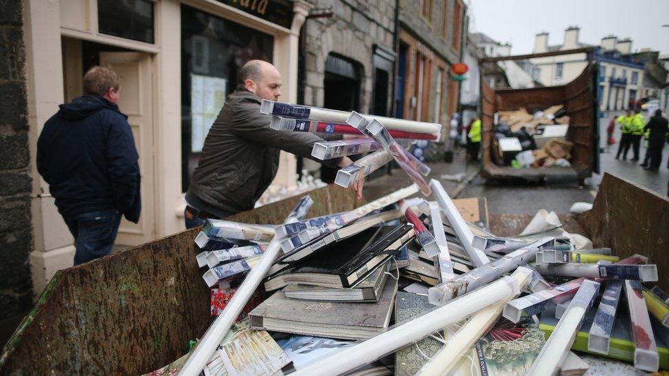 In Newton Stewart, Scotland, locals begin to clear-up rubbish from Storm Frank