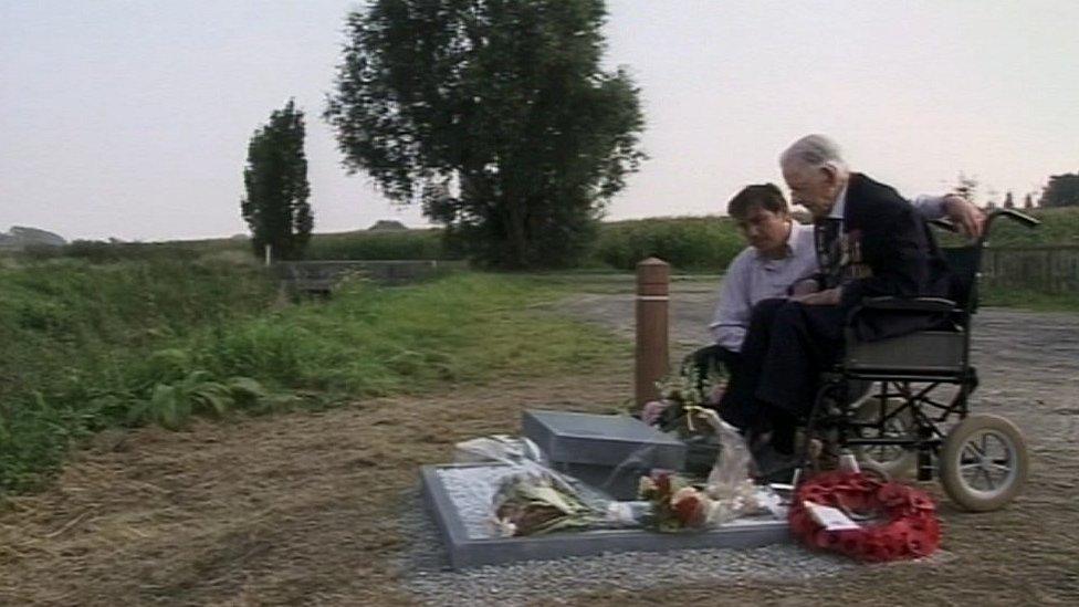 Harry Patch looking at the stone