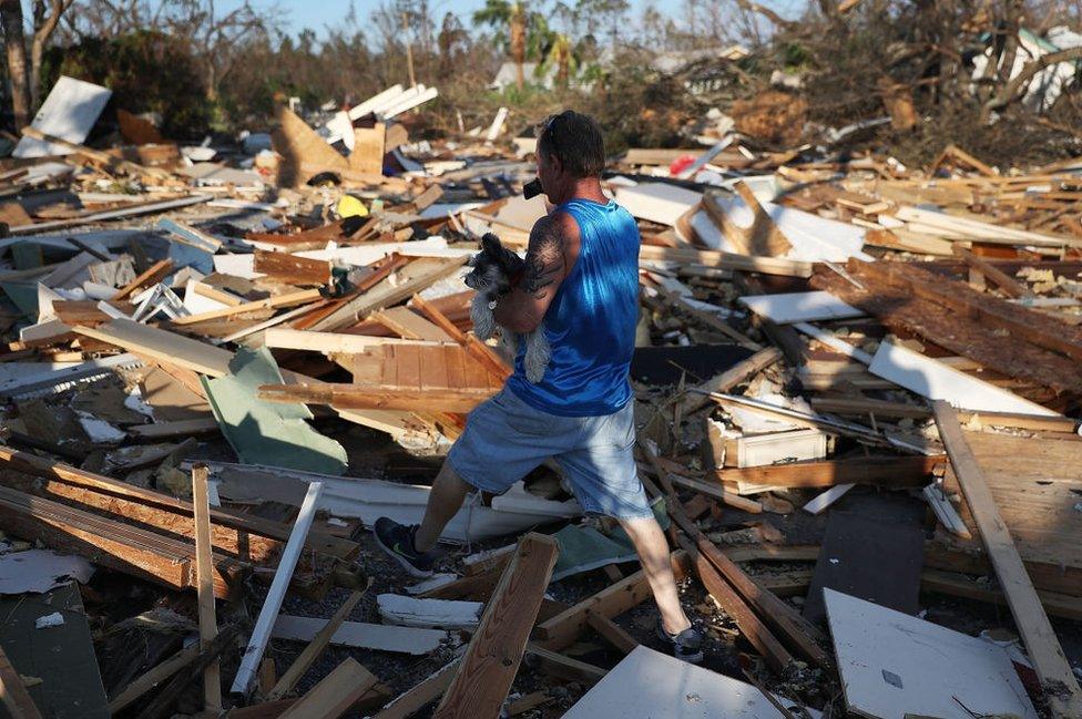 A man surveys his street in Mexico Beach, Florida