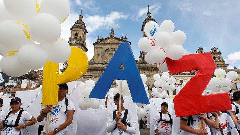 People form the word Peace with letters at the Bolivar square outside the cathedral in Bogota, Colombia, September 26, 2016.