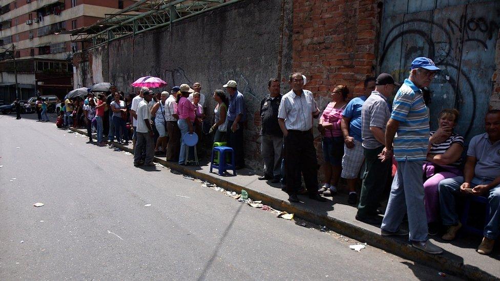 People queuing for food