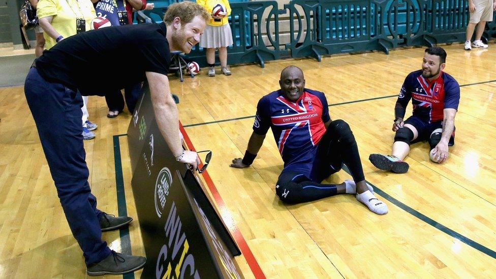 Prince Harry chats to members of the UK sitting volleyball team