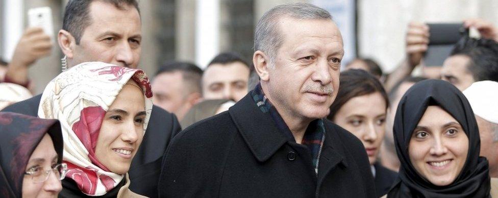 Turkish President Tayyip Erdogan, accompanied by his daughter Sumeyye Erdogan (second left), poses with his supporters as he leaves the Eyup Sultan mosque in Istanbul, Turkey, 2 November 2015