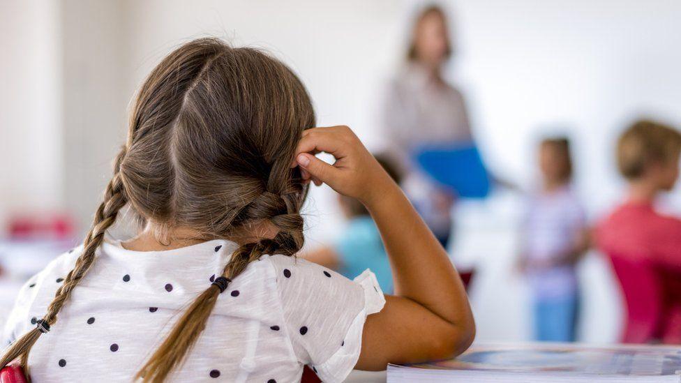 A young girl in a classroom