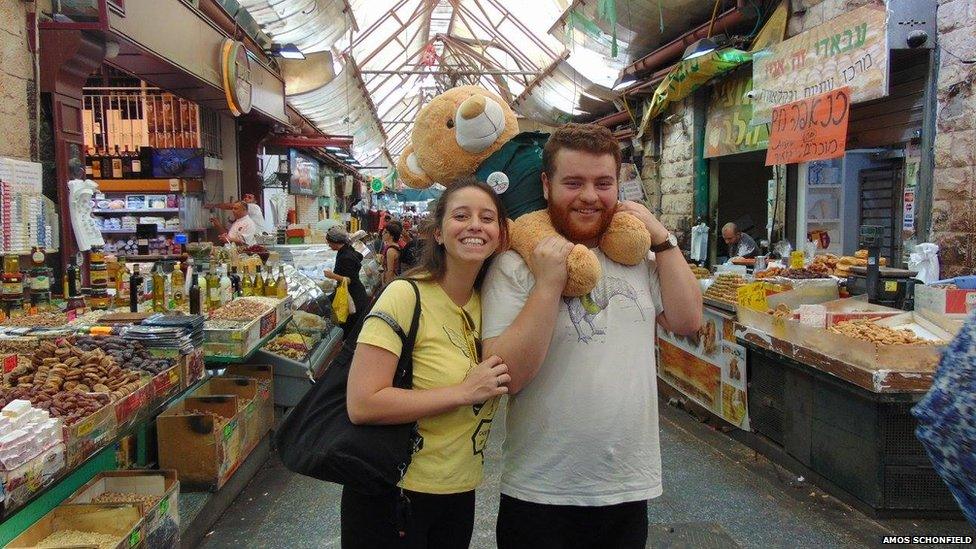 Amos Schonfield in a market in Jerusalem with a friend