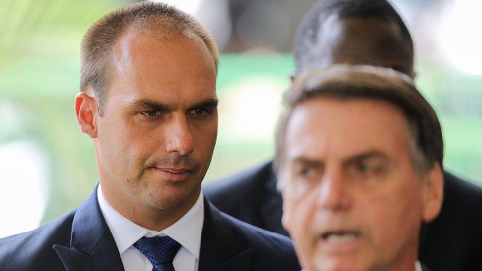 President-elect Jair Bolsonaro (R) and his son Eduardo Bolsonaro (L) are seen at the headquarters of the transitional government in Brasilia