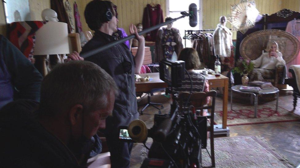 film crew shooting actress in the sea