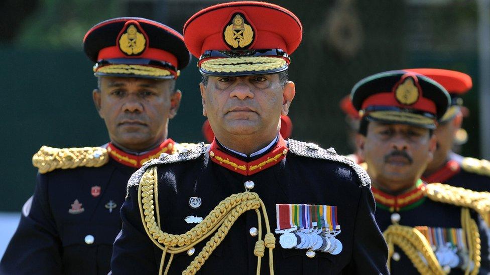 Sri Lanka's outgoing army chief Jagath Jayasuriya (C) and his successor, Major General Daya Ratnayake (L) arrive at a farewell ceremony in the capital Colombo on July 30, 2013.