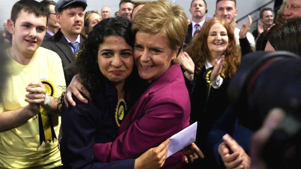 Surrounded by SNP activists a jubilant Roza Salih is hugged by a smiling Nicola Sturgeon at the count where she became the first refugee to be elected to Glasgow City Council 