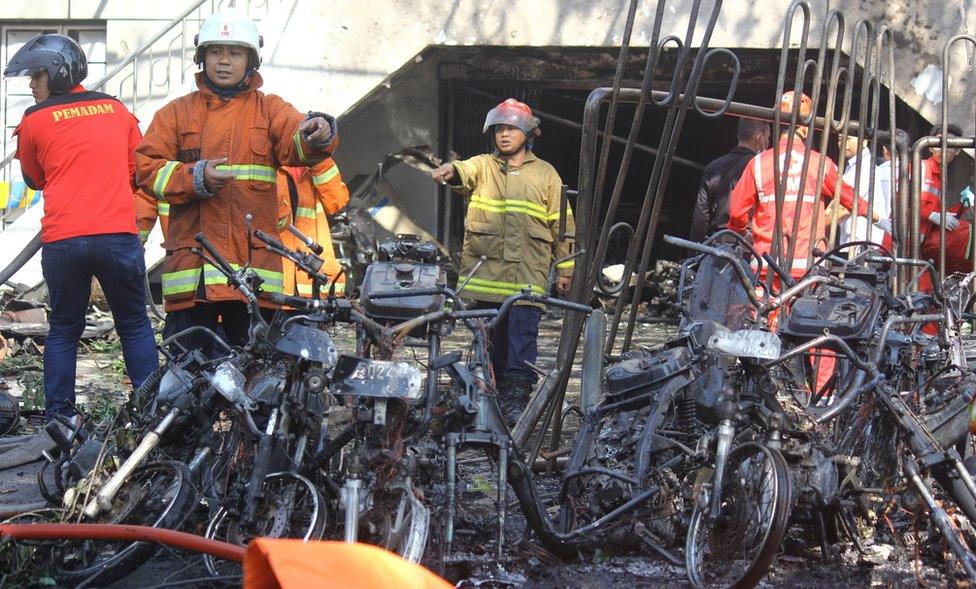 Firefighters are seen at the site of a blast at the Pentecost Church Central Surabaya (GPPS), in Surabaya, East Java, Indonesia, 13 May 2018