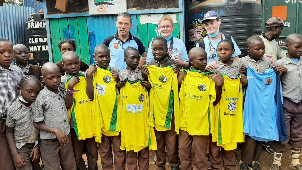 Children with donated shirts