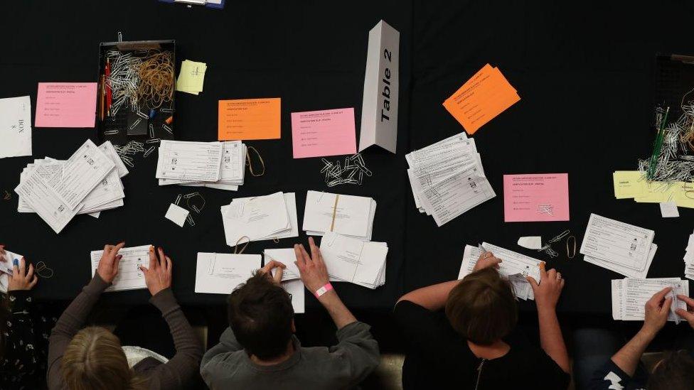 Members of staff count ballots at the Westmorland and Lonsdale constituency counting centre in Kendal