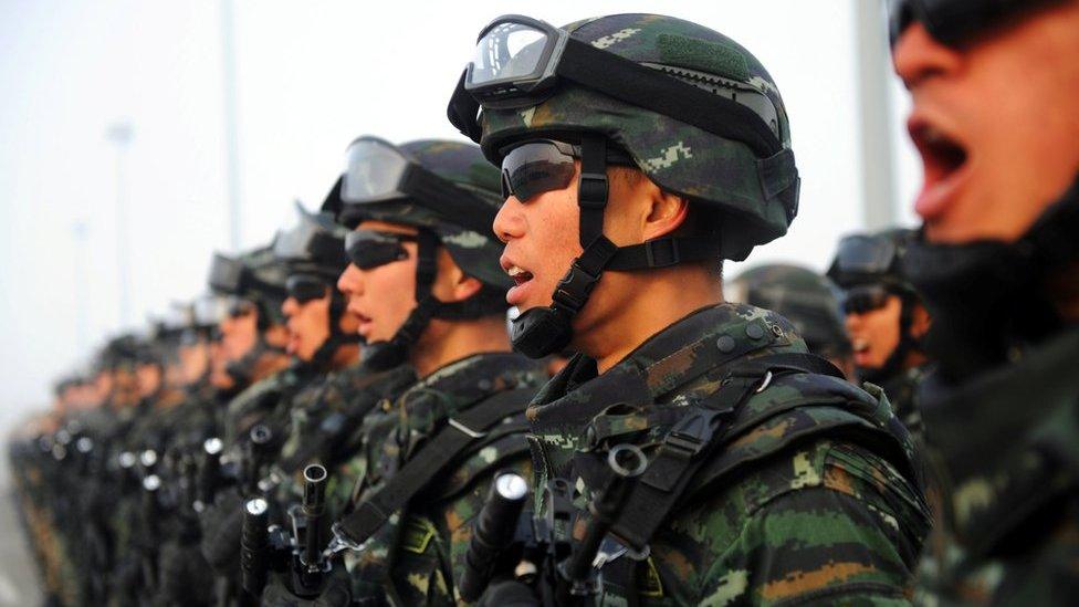 Paramilitary policemen stand in formation as they take part in an anti-terrorism oath-taking rally, in Kashgar, Xinjiang Uighur Autonomous Region, China, February 27, 2017.