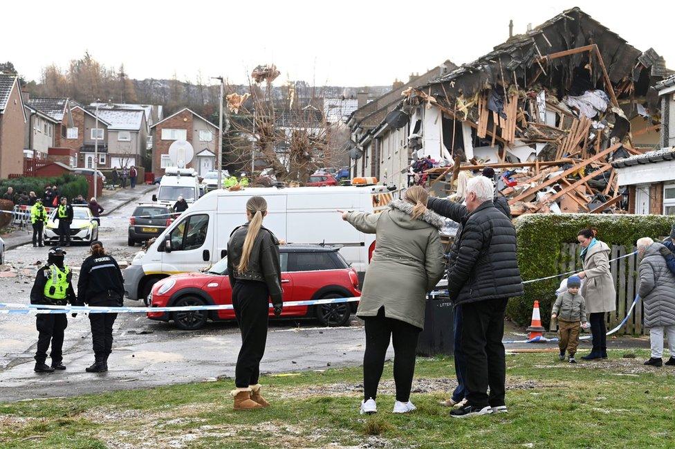 Locals survey the damage on Saturday