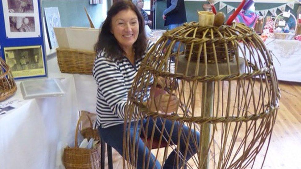 Sue Morgan weaving a withy pot