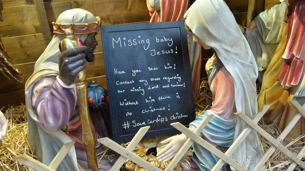 Nativity with a sign advertising missing Jesus at Cardiff Christmas Markets