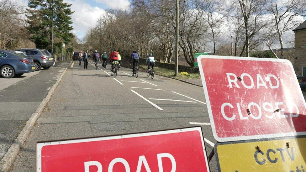 Cycling past the signs