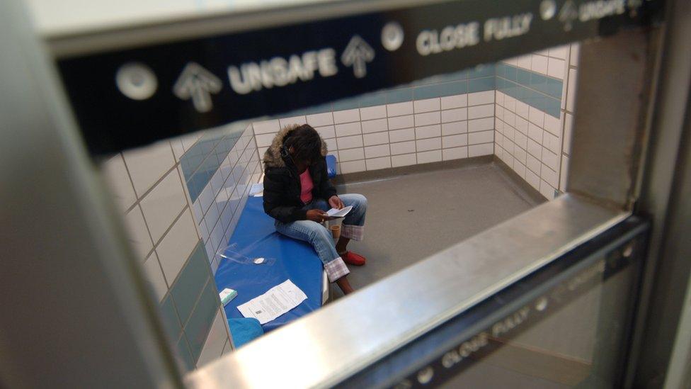 Woman in police cell