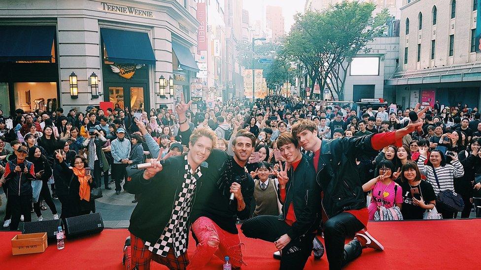 The boys performing in downtown Seoul