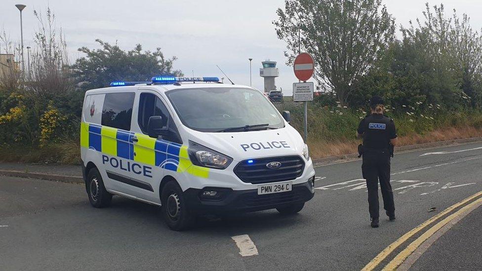 Police van blocking airport road