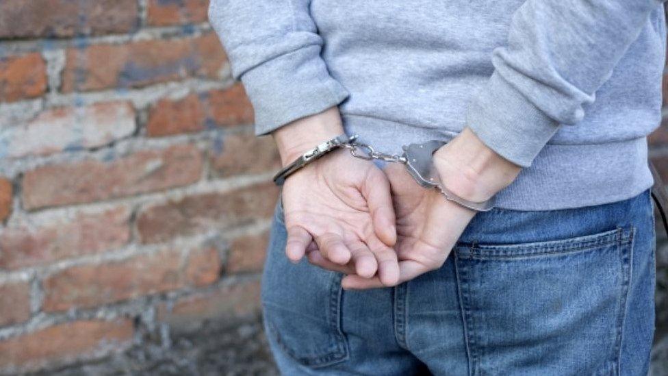 Handcuffed male