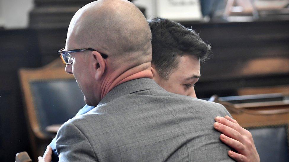 Kyle Rittenhouse hugs one of his attorneys Corey Chirafisi as he reacts to the verdict during his trial at the Kenosha County Courthouse in Kenosha, Wisconsin, U.S., November 19, 2021.