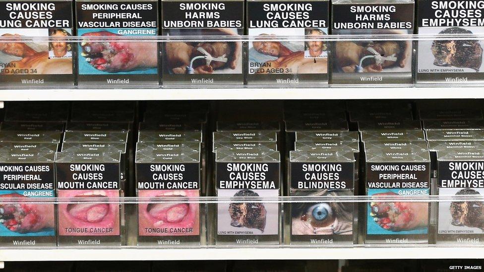 Cigarettes in plain packaging with health warnings, in an Australian store