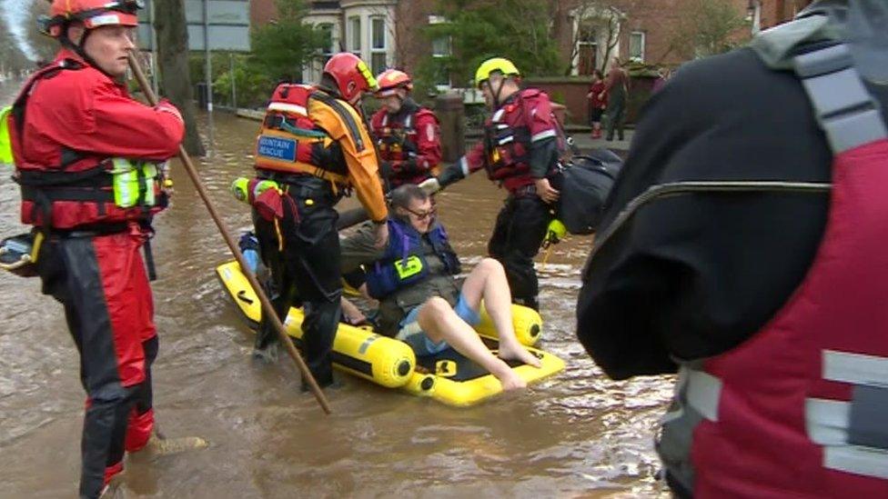 Mountain rescue volunteers help flooded residents in Cumbria