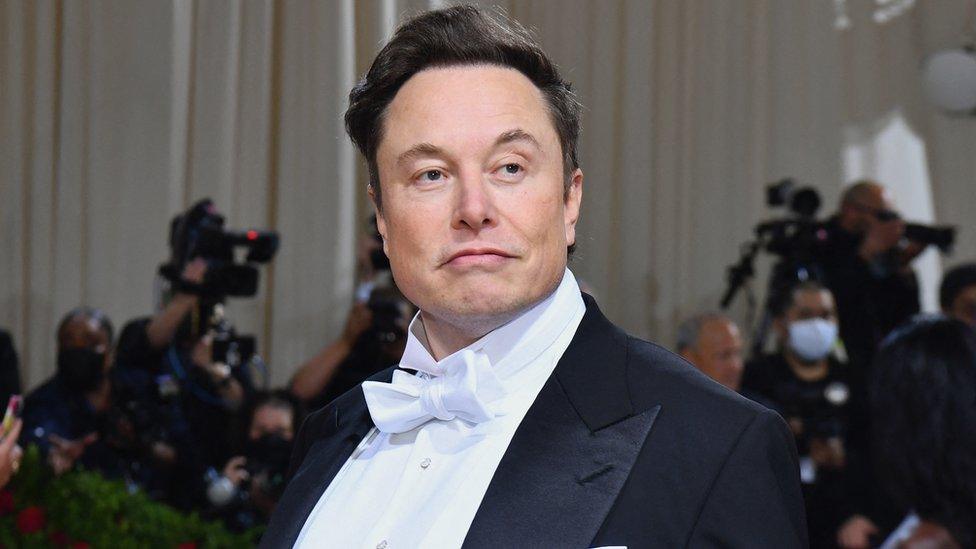 Elon Musk in a suit