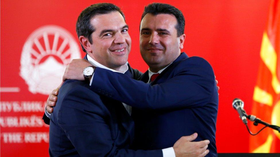 Greek Prime Minister Alexis Tsipras (L) and North Macedonian Prime Minister Zoran Zaev hug as they attend a news conference in Skopje, North Macedonia April 2, 2019