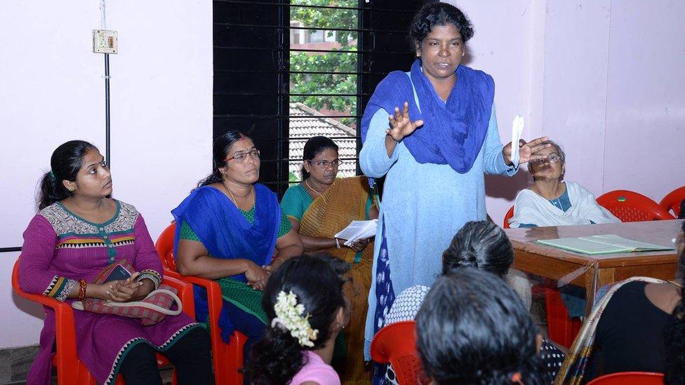 Viji Palithodi addresses a group of women