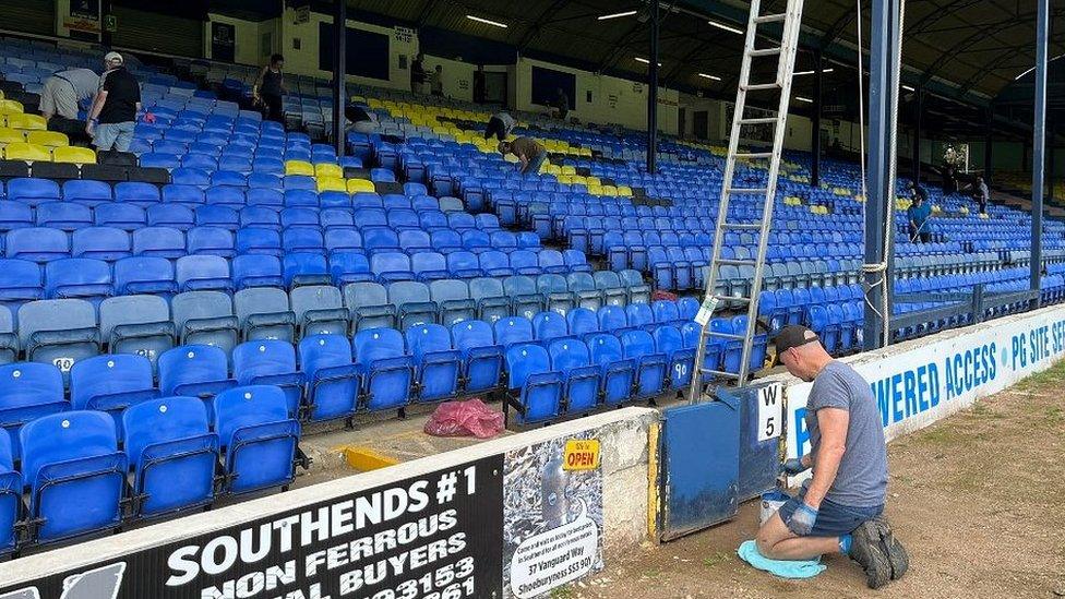 Southend United fans clearing up Roots Hall Stadium