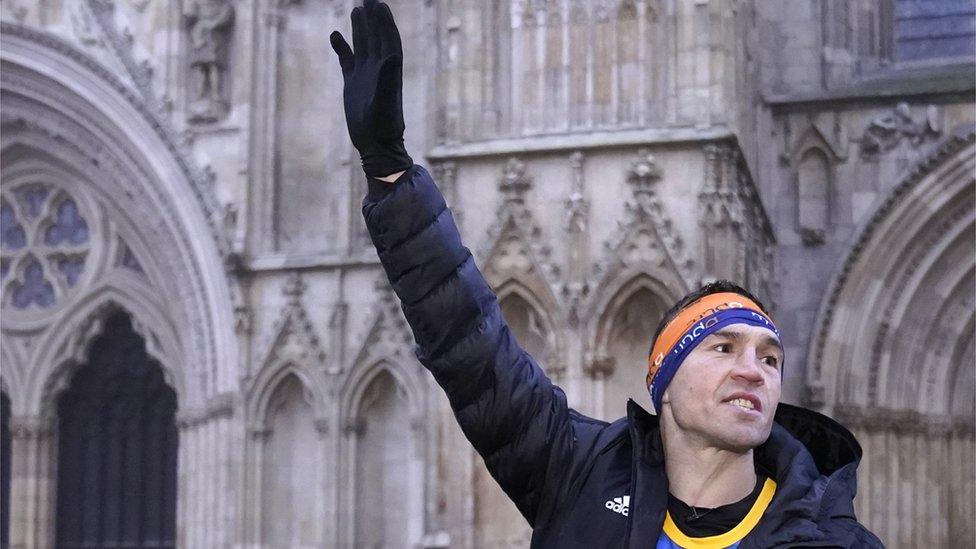 Kevin Sinfield waving outside York Minster