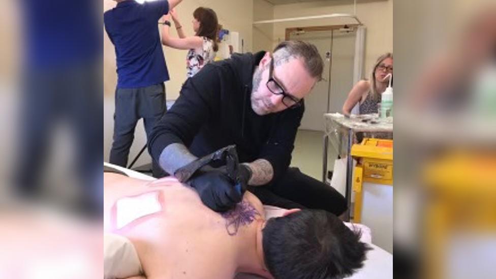 Kevin Paul tattooing Martin Hibbert