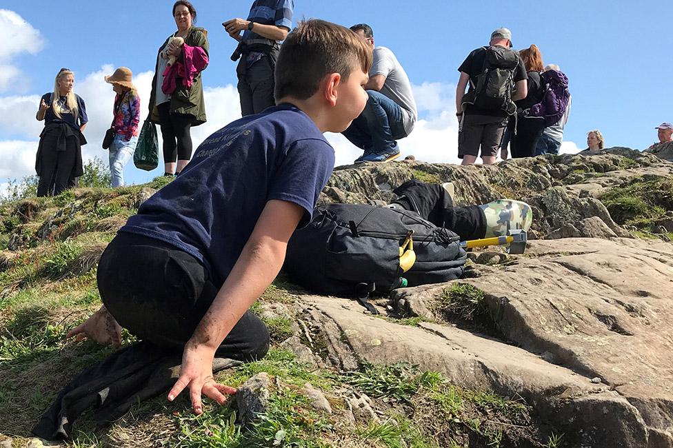 Tony Hudgell on the ground at the summit of Orrest Head in the Lake District