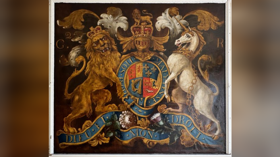The restored coat of arms, which is very clear and colours are very clear.